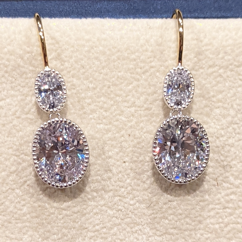 Oval Cubic Zirconia French-Wire Drop Earrings. Gold and Rhodium plated silver.